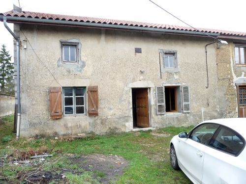 Réaménagement d'une maison ancienne en Pisé